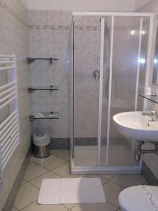 a bathroom with a shower and a sink at Albergo Meublè Abatjour in Mantova