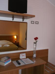 Postel nebo postele na pokoji v ubytování Albergo Meublè Abatjour