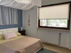 Giường trong phòng chung tại B&B Tenuta la Cornula