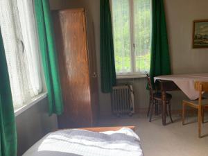 Postelja oz. postelje v sobi nastanitve Albergo Calancasca Ristorante Jaipur