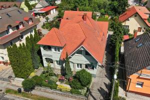 a large house with an orange roof at Park Apartman Hévíz in Hévíz