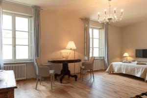 מיטה או מיטות בחדר ב-IN LUCUS Guest House