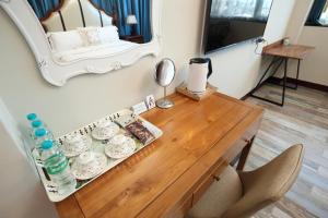 a room with a table with a mirror on the wall at Min Le Yuan B&B-include long stay in Hualien City