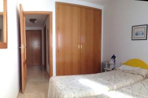 Postel nebo postele na pokoji v ubytování Apartamento vacaciones en Gemelos 22 + 22 fotografií