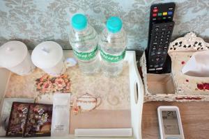 two bottles of water sitting on top of a table at Min Le Yuan B&B-include long stay in Hualien City