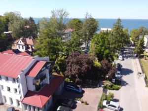 an aerial view of a building with a red roof at Willa Onyks Apartamenty in Jastrzębia Góra