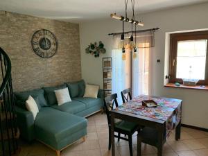 a living room with a couch and a table at La Casa del Mastro - Como Lake in Pognana Lario