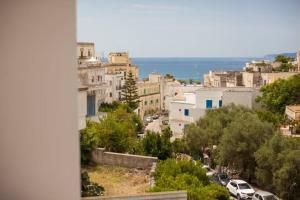 a view of a city with cars parked on a street at Civico 53 in Castro di Lecce