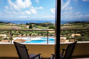 a view of a swimming pool from a balcony at Hotel Santa Chiara in Capo Vaticano