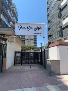 a gate with a sign that reads pink star met at Apartamento primera línea de Mar Enjoy the view in Blanes