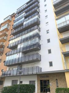 an apartment building with balconies on the side of it at Apartamento primera línea de Mar Enjoy the view in Blanes
