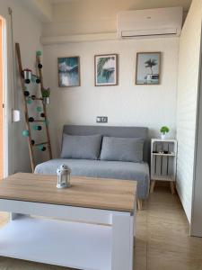 a small room with a bed and a table at Apartamento primera línea de Mar Enjoy the view in Blanes