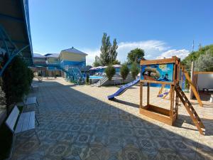 a playground with a slide at Aquamarin in Zatoka