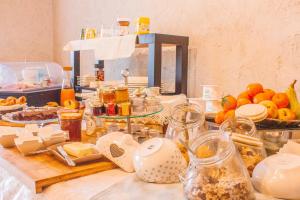 a table with a bunch of food on it at Orchidea Del Garda in Peschiera del Garda