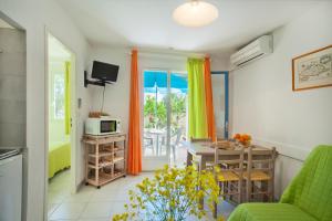 TV a/nebo společenská místnost v ubytování Residence Motel Corsicana