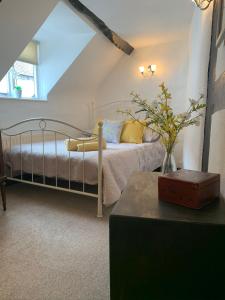 a bedroom with a bed in a attic at Stylish 3 bedroom apartment in Upton upon Severn