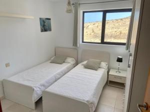 Postel nebo postele na pokoji v ubytování Ocean View Apartament