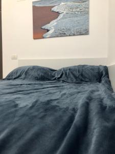 מיטה או מיטות בחדר ב-Smaraldul Madalinei