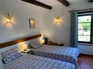 A bed or beds in a room at Quinta Falzina