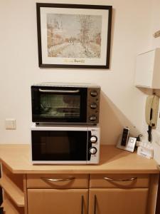 a microwave oven sitting on top of a table at Appartmenthaus Birkenwald in Seefeld in Tirol