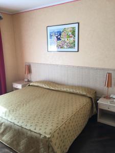 Postel nebo postele na pokoji v ubytování Serravalle Golf Hotel