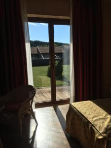 Postel nebo postele na pokoji v ubytování Serravalle Golf Hotel