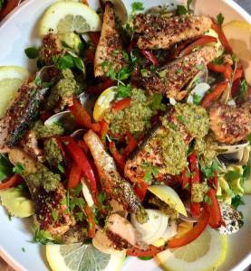 a white plate of food with fish and vegetables at Cottage Vivenda Festina Lente in Figueiró dos Vinhos