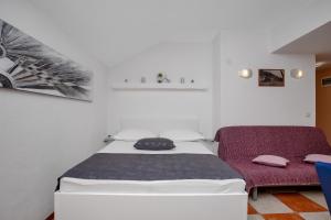 Postel nebo postele na pokoji v ubytování Apartman Toni