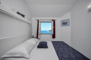 Postel nebo postele na pokoji v ubytování Apartman Toni