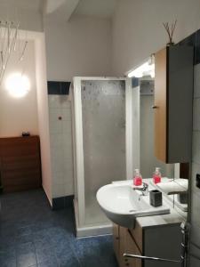 a bathroom with a sink and a shower at Come A Casa Tua in Falconara Marittima