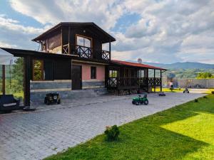 a house with a pavilion with a lawn in front of it at Комплекс язовир Валтата Komplex yazovir VALTATA in Samuilovo