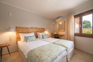 A bed or beds in a room at Dimoulias House