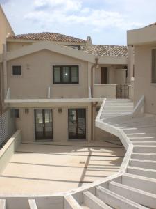 a house with concrete steps in front of it at Casa Malù in Pula