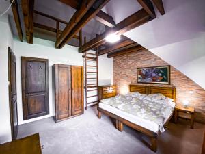 A bed or beds in a room at Apartmán s výhľadom na Lomnický štít