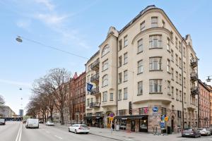 a building on a city street with cars parked on the street at Best Western Hotel at 108 in Stockholm