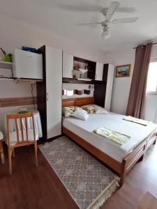 a bedroom with a large bed and a table at Apartments Ivanković in Stari Grad +77 photos