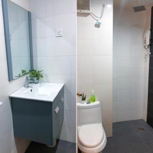 a bathroom with a toilet and a sink and a mirror at Agrima Studio Apartment in Kota Bharu