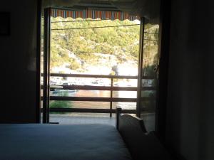 a room with a view of a room with a window at Apartments Krpan in Donja Klada