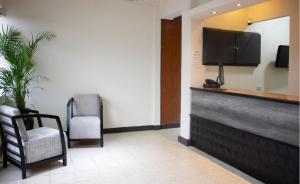 TV a/nebo společenská místnost v ubytování Hotel Winn Comfort