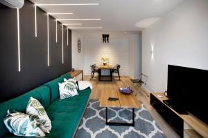Televízia a/alebo spoločenská miestnosť v ubytovaní P&O Serviced Apartments Group Komputerowa