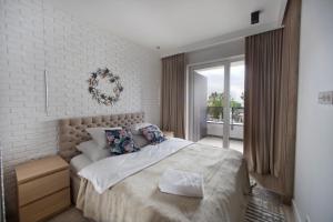 Posteľ alebo postele v izbe v ubytovaní P&O Serviced Apartments Group Komputerowa