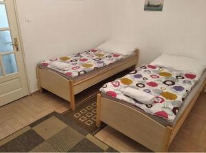 Postel nebo postele na pokoji v ubytování SaraHome4 Center
