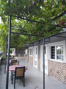 a patio with a table and chairs and a building at Akdeniz apart hotel in Marmaris