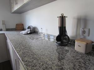 a kitchen with a counter with a mixer on it at Casa das Nações in Donas