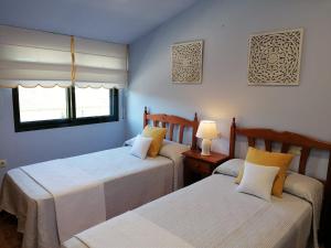 Posteľ alebo postele v izbe v ubytovaní Apartamentos Marsó