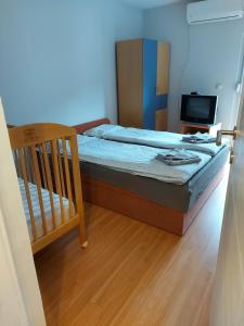 Postel nebo postele na pokoji v ubytování Perucac Apartment