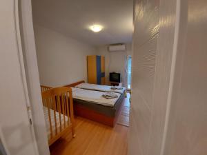 Postel nebo postele na pokoji v ubytování Perucac Apartment