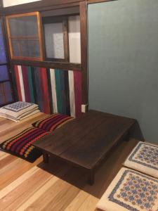 Postel nebo postele na pokoji v ubytování 一棟貸し宿bochi-bochi