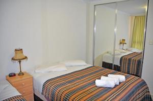 Postel nebo postele na pokoji v ubytování Accommodation Sydney - Pitt Street