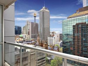 a view of a city skyline from a balcony at Accommodation Sydney - Kent Street Sydney CBD Top floor 2 bedroom apartment with balcony in Sydney